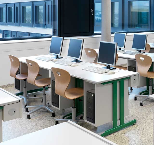 Monitor-desks with skid frame for students